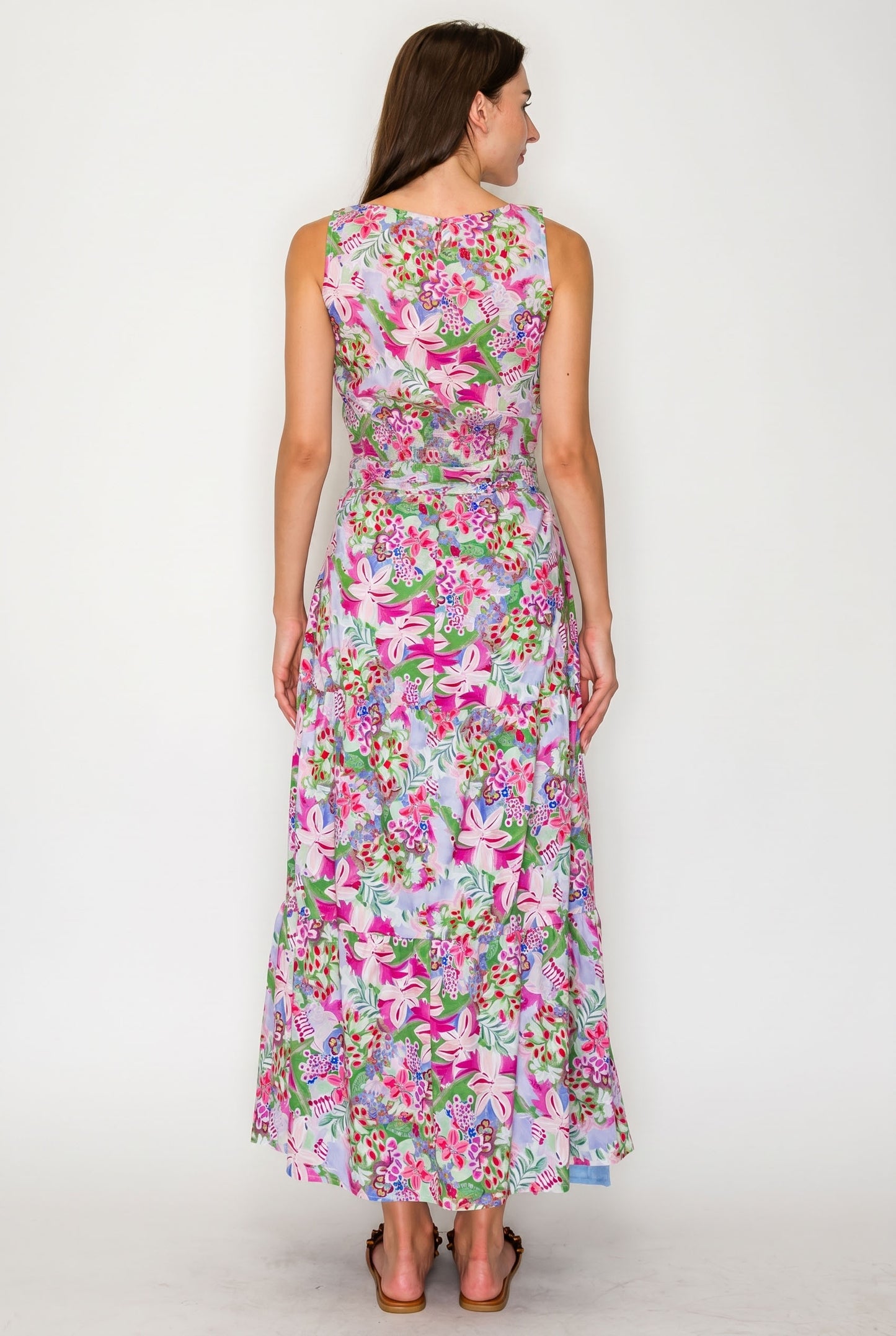 Woman wearing a floral dress on a white background