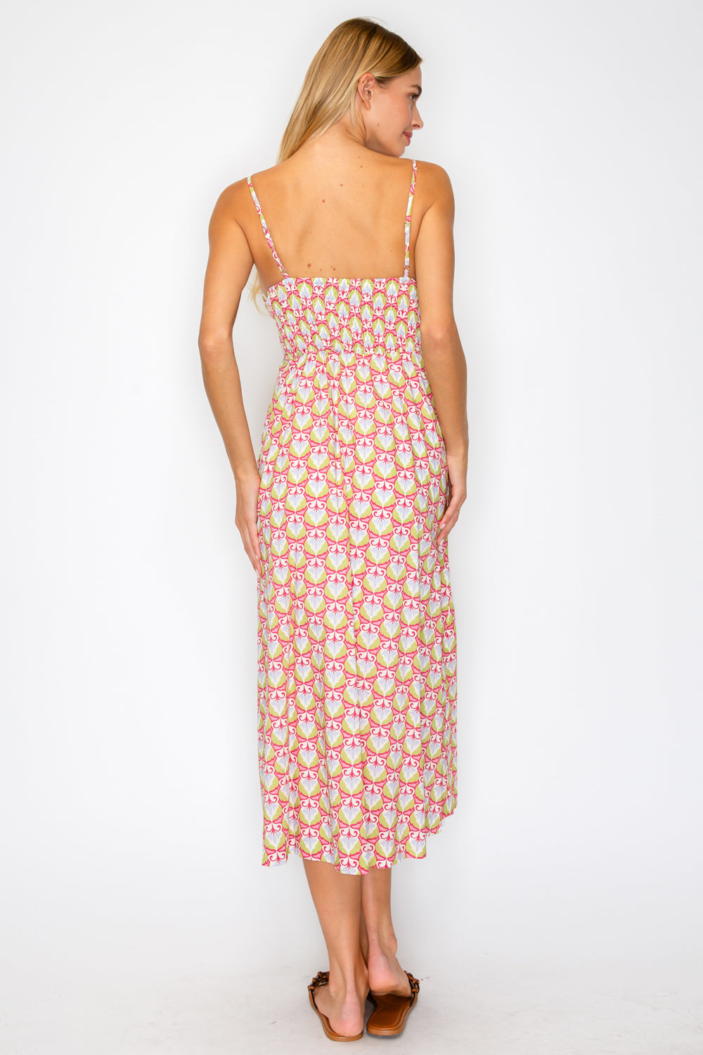 Woman wearing a floral dress on a white background