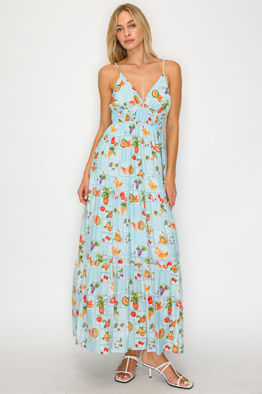 Woman wearing a floral dress with a white background