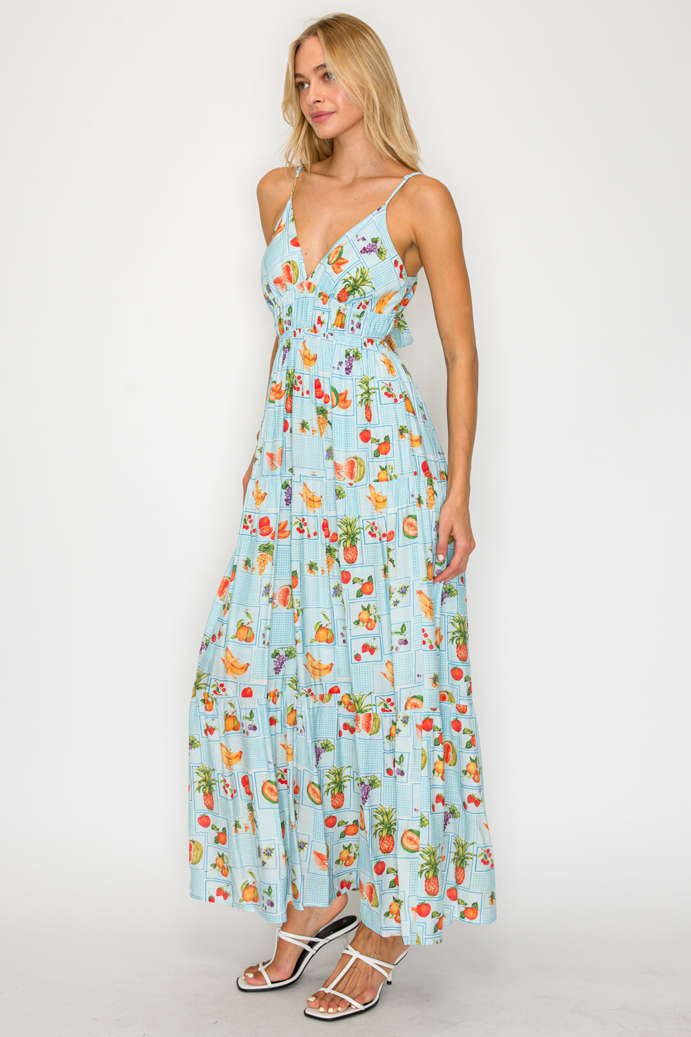 Woman wearing a floral dress with a white background