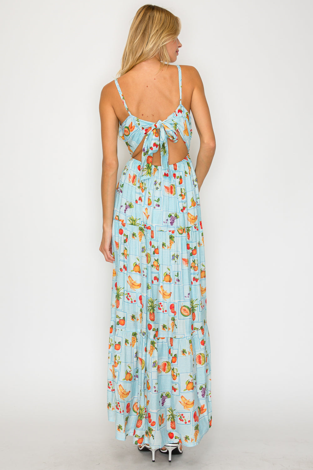 Woman wearing a floral dress with a white background