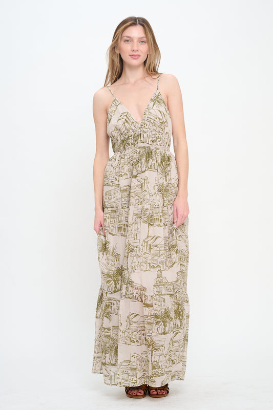 Model wearing Santorini Olive Sketch Maxi Dress with deep V-neckline, adjustable spaghetti straps, and olive village sketch print.