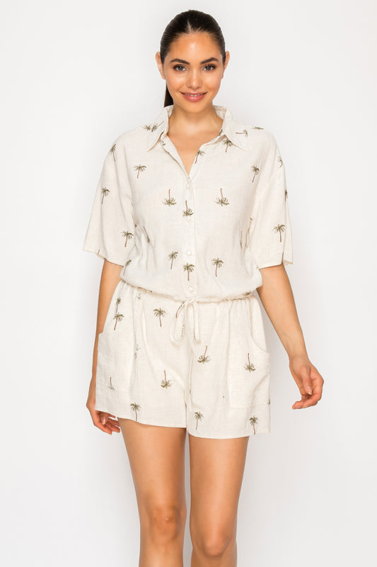 Shop the Drifting Palms Shorts at Meet Me in Santorini. A chic pair of shorts with a palm tree print, drawstring waist, and pockets. Perfect for vacation.