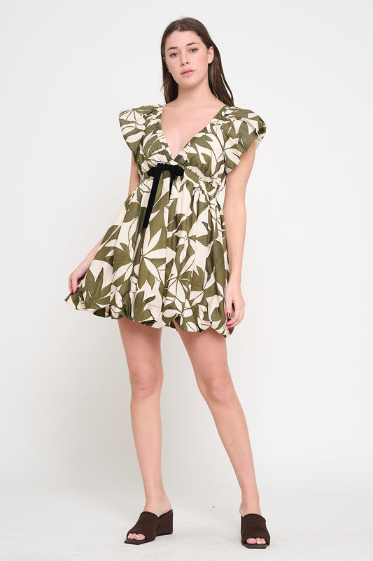 Emerald Canopy Bubble Dress with deep V-neck, cap sleeves, velvet waist tie, and tropical leaf print