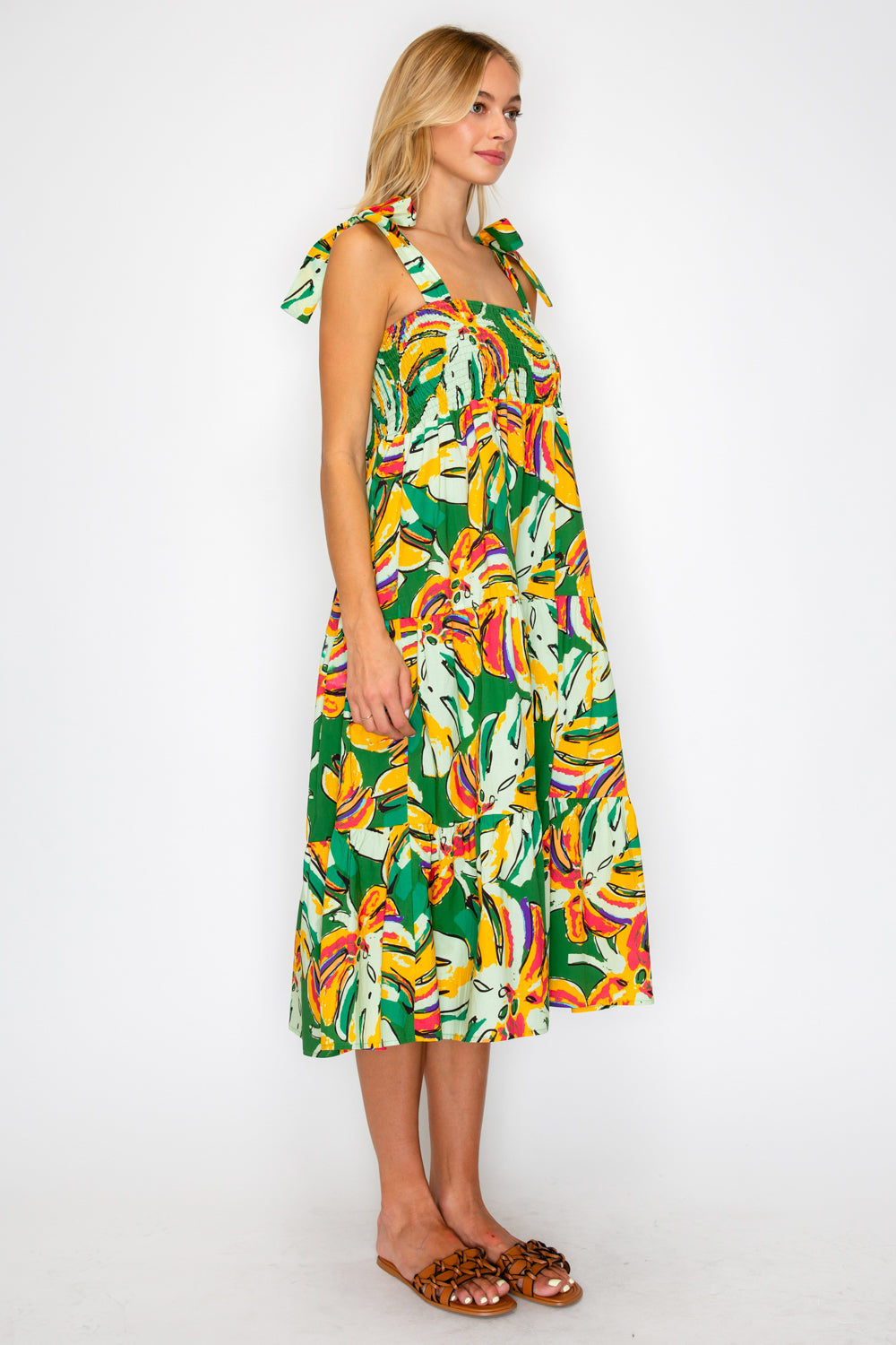Woman wearing a colorful dress with a white background