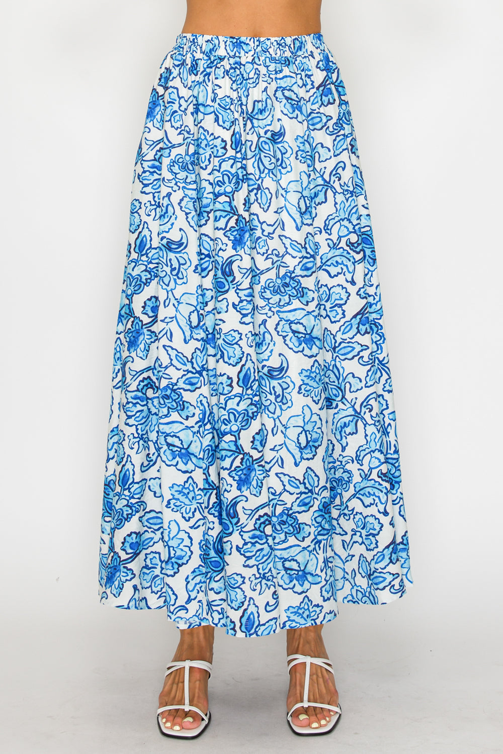 Blue floral patterned skirt on a white background