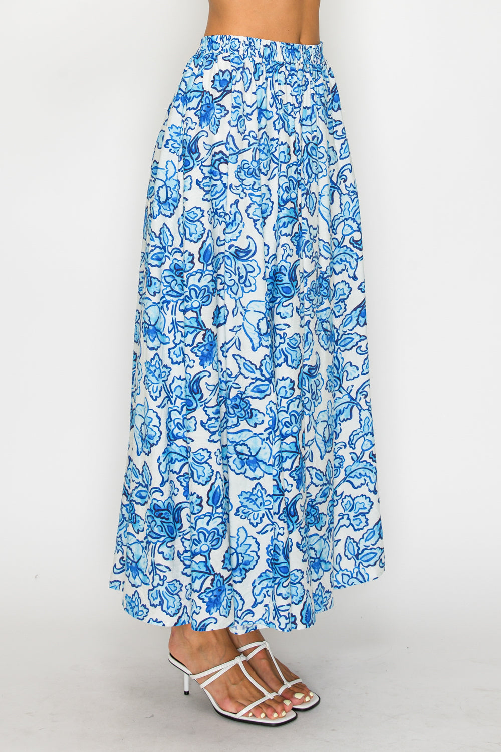 Blue floral patterned skirt on a white background