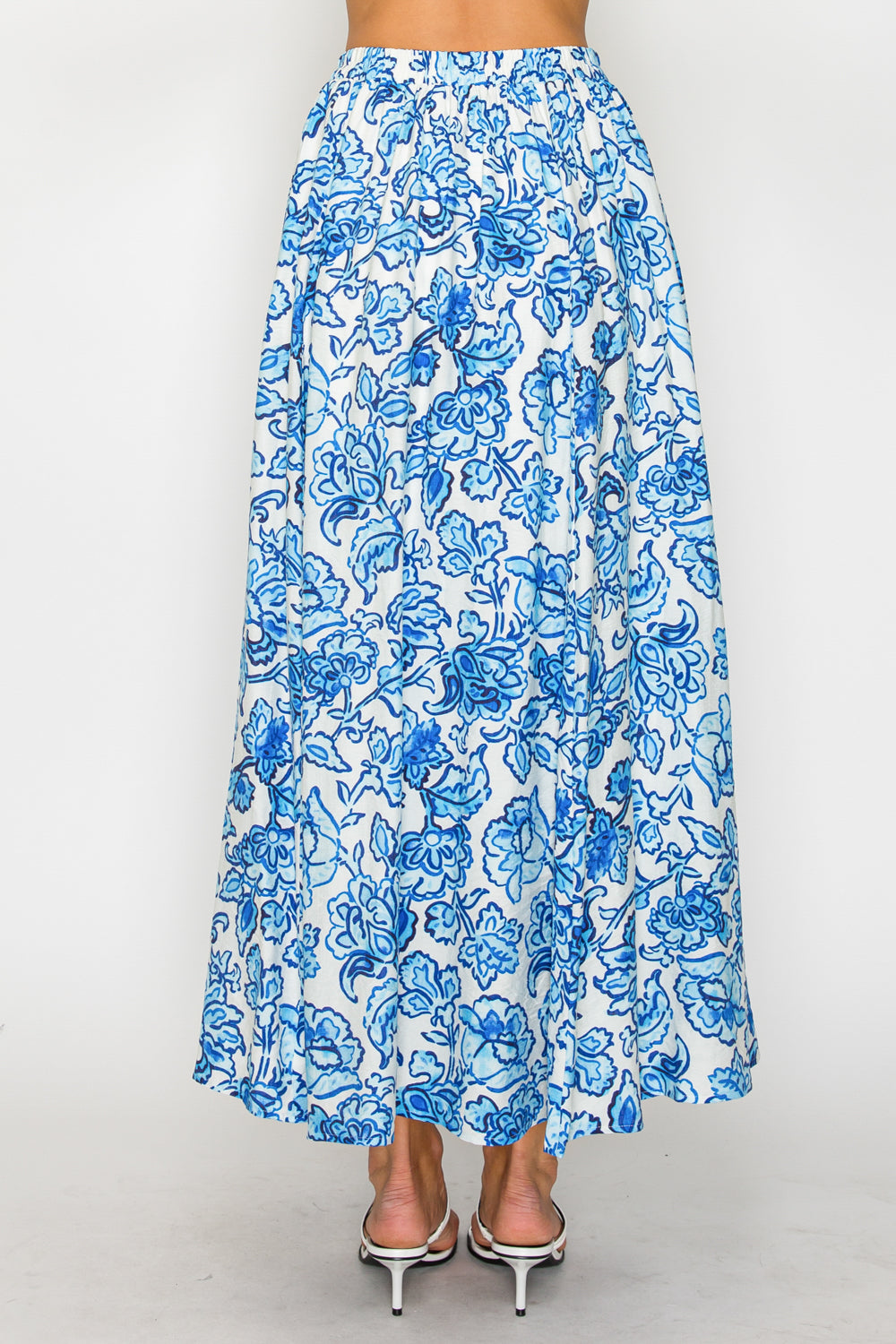 Blue floral patterned skirt on a white background