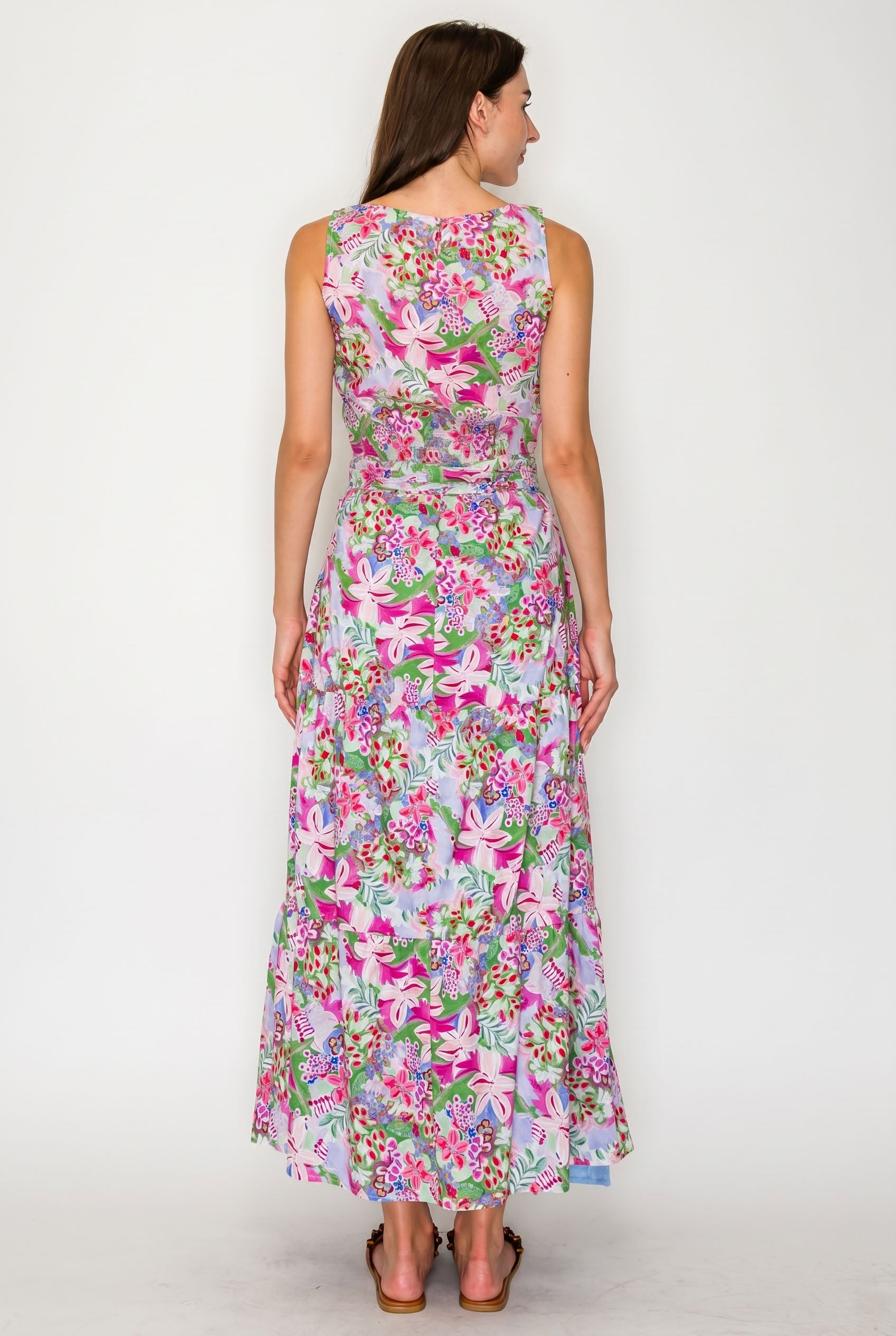 Woman wearing a floral dress on a white background