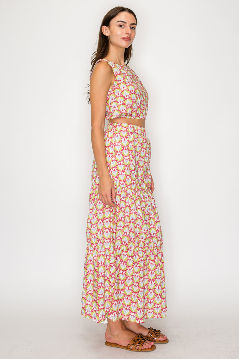 Woman wearing a floral dress on a white background
