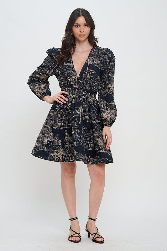 Model wearing the Santorini Midnight Sketch Dress, a black and beige printed mini dress with a V-neck, long bishop sleeves, and an A-line skirt.