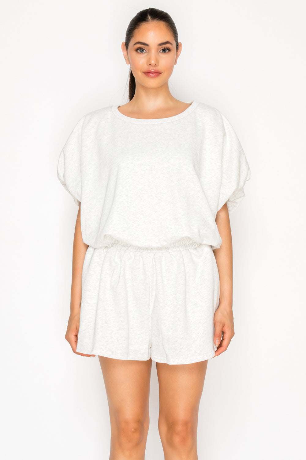 Model wearing the Grey French Terry Set, a two-piece lounge set with a dolman sleeve top and matching shorts.