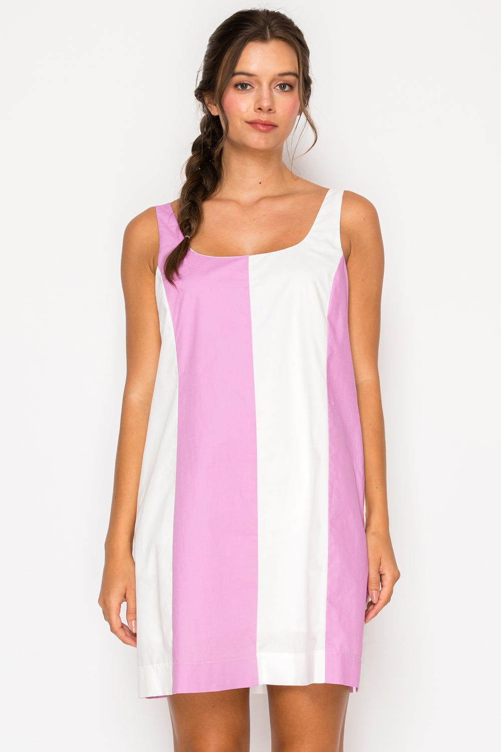 Model wearing the Pink Poplin Color Block Dress, a pink and white shift mini dress with a square neckline.