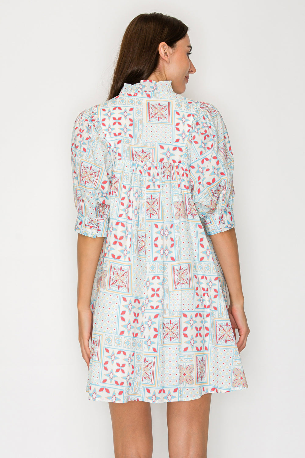 Woman wearing a floral dress on a white background