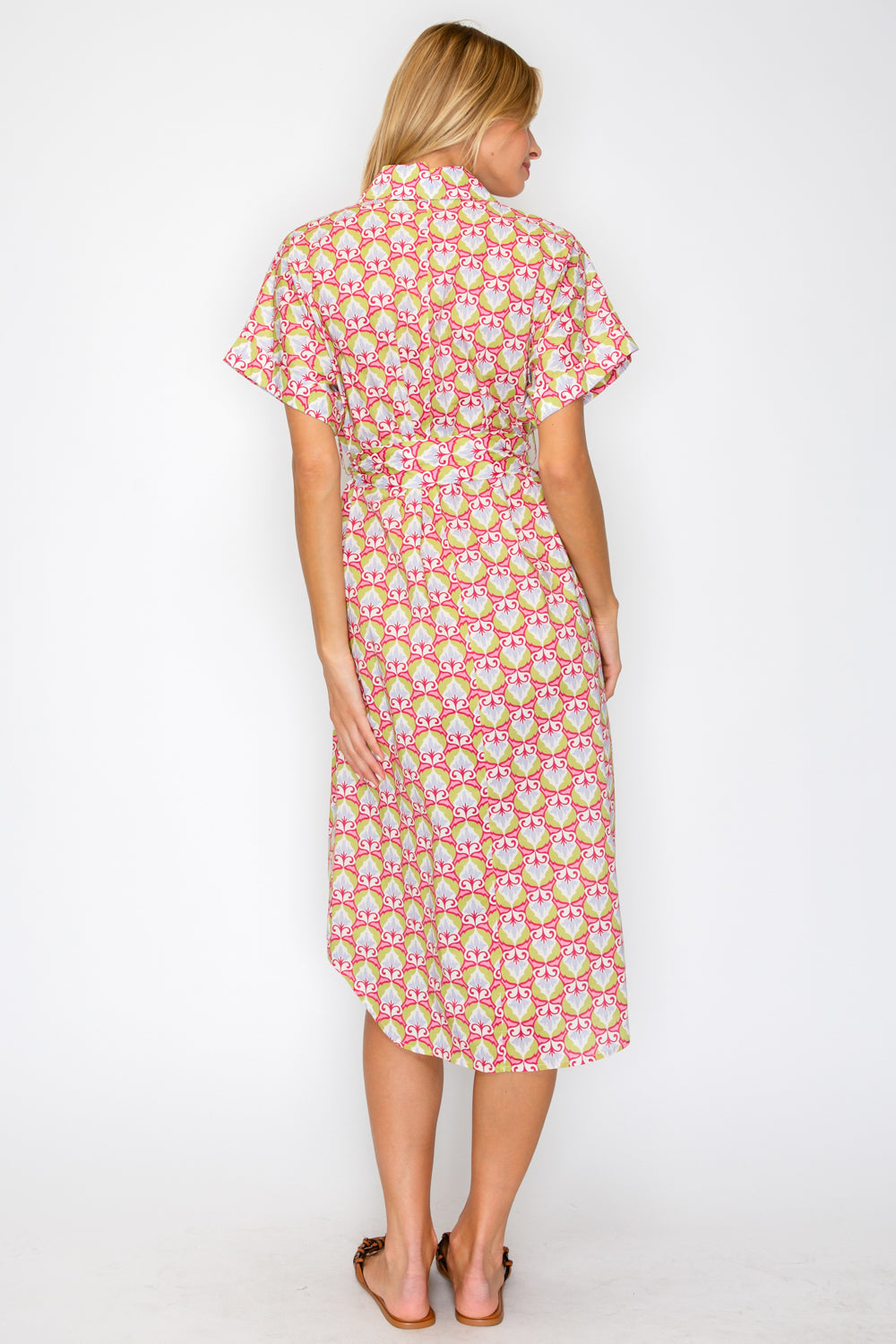Woman wearing a floral dress on a white background