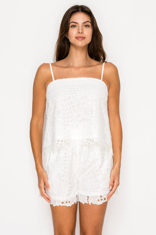 Model wearing the White Floral Lace Set, a two-piece set with a lace cami top and matching lace shorts.