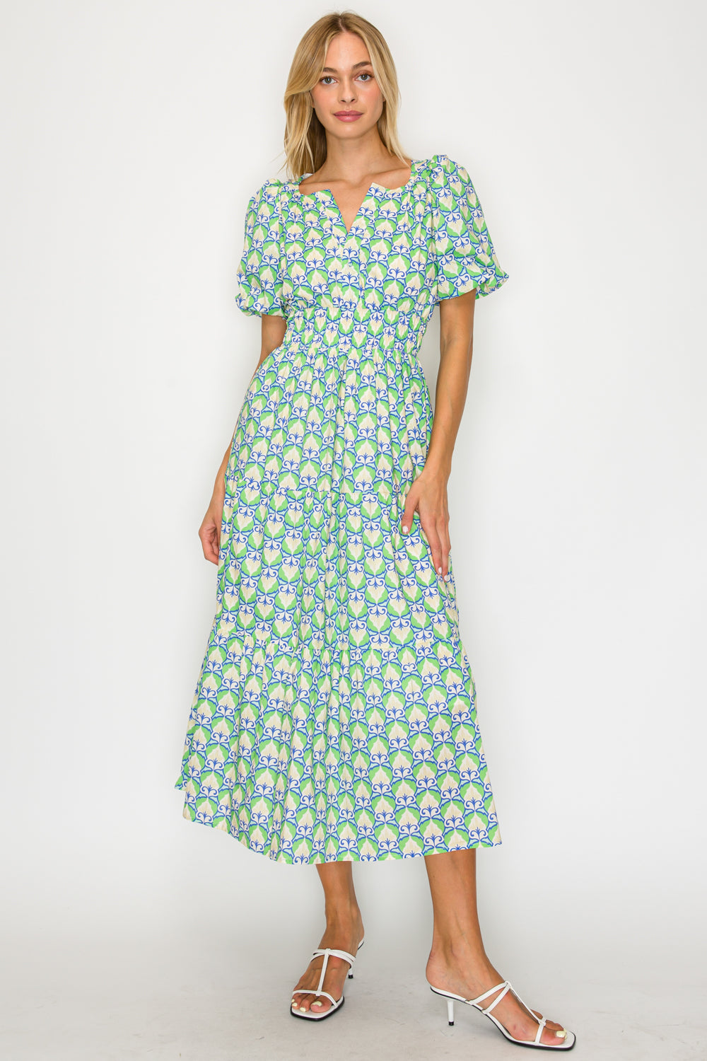 Woman wearing a floral dress on a white background