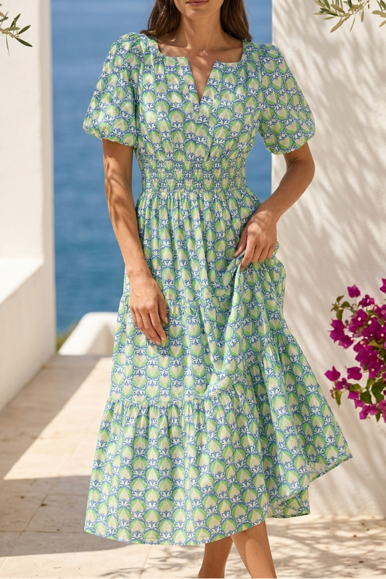 Woman wearing a floral dress by the sea