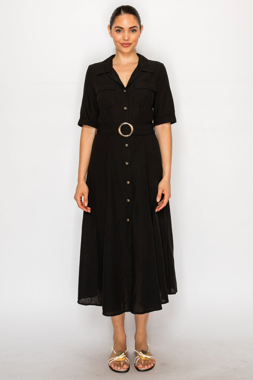 Model wearing the Black Linen Shirt Dress from Meet Me in Santorini, featuring a button front, collared neck, and a wide belt with a circle buckle.