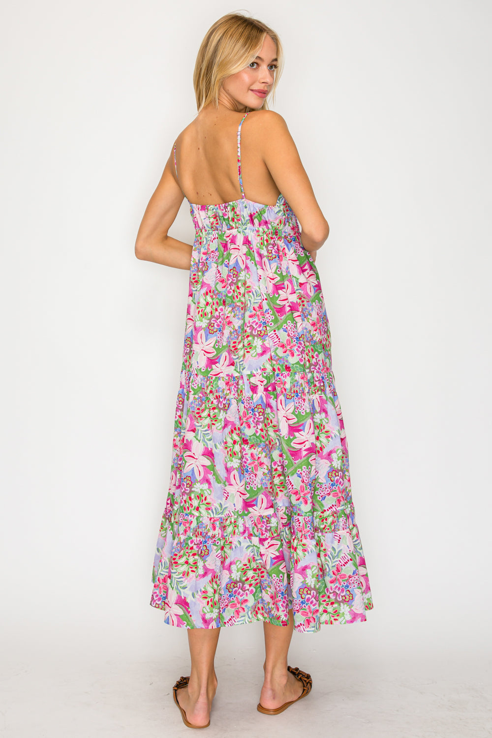 Woman wearing a floral dress on a white background